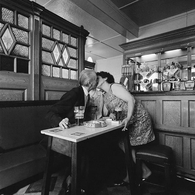 © Sirkka-Lissa Konttinen - A couple kissing in a pub