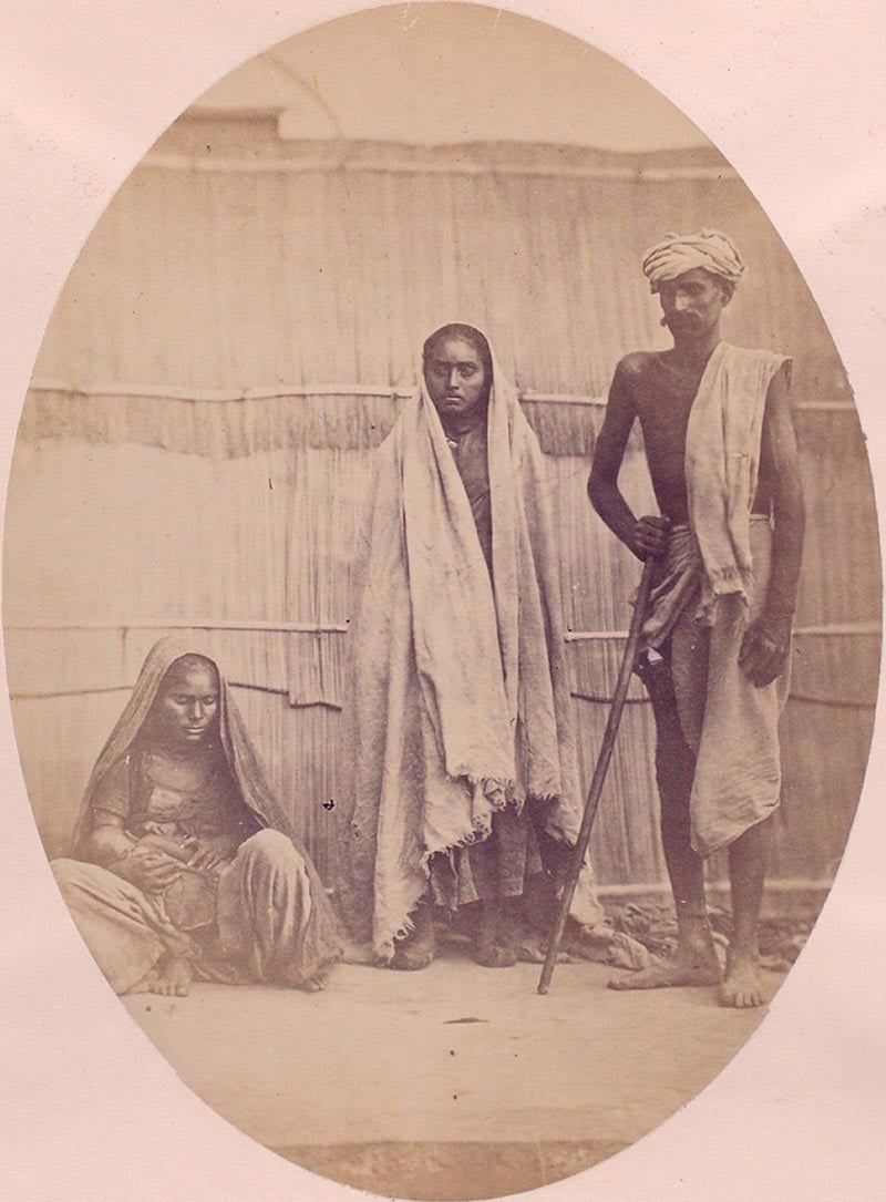 Extract from 'People of India' photobook showing three sansee tribespeople