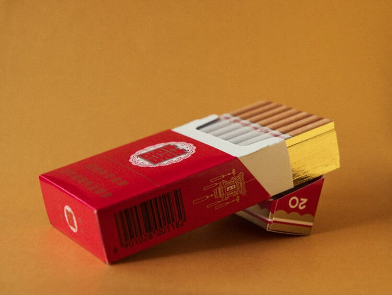 Extract from Beijing Silvermine photobook - Red packet of cigarettes on yellow background