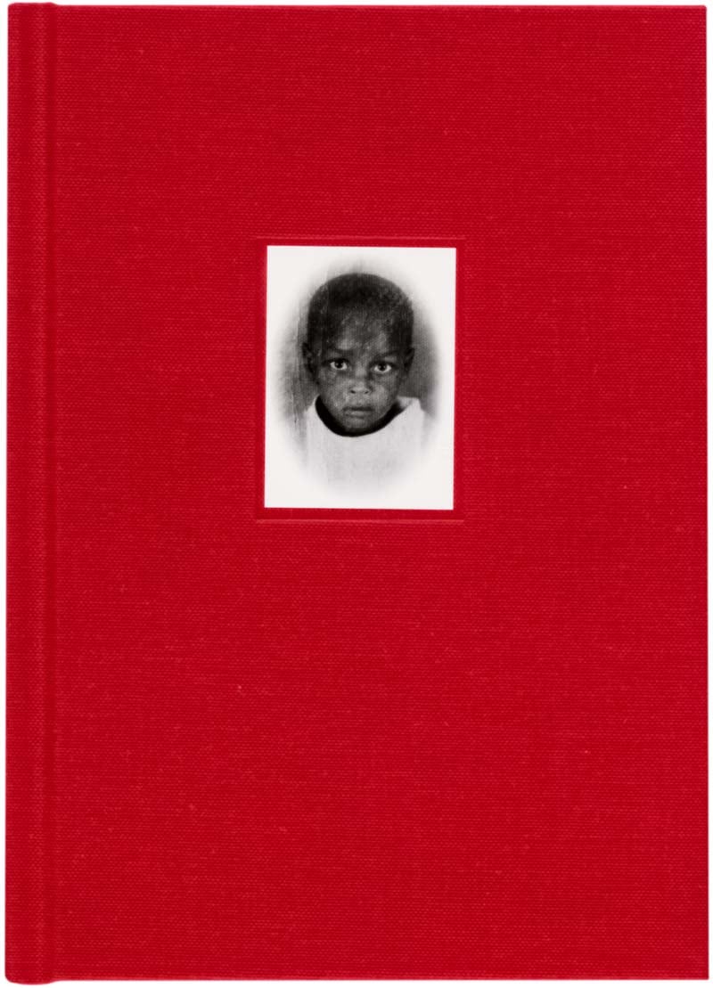 22 Days in Between photobook cover by Salih Basheer - small portrait of a young boy on a red background