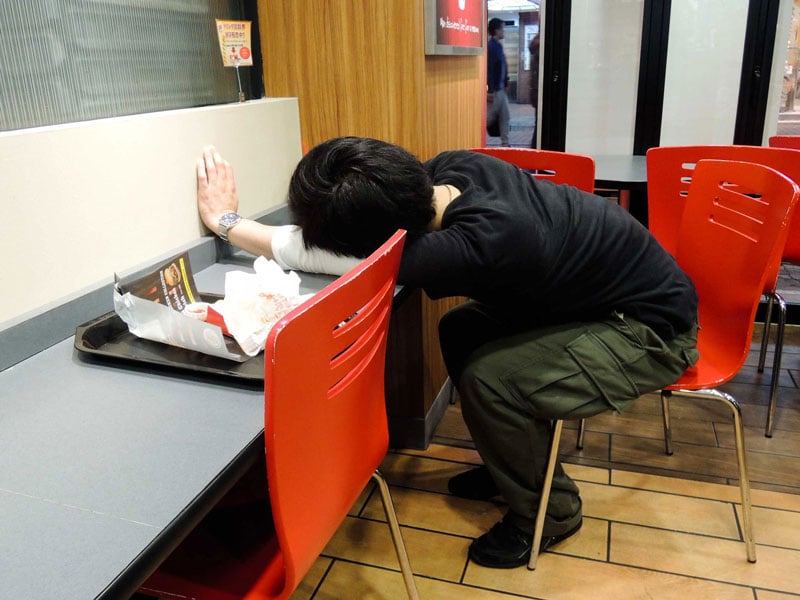 Man asleep in a McDonalds restaurant