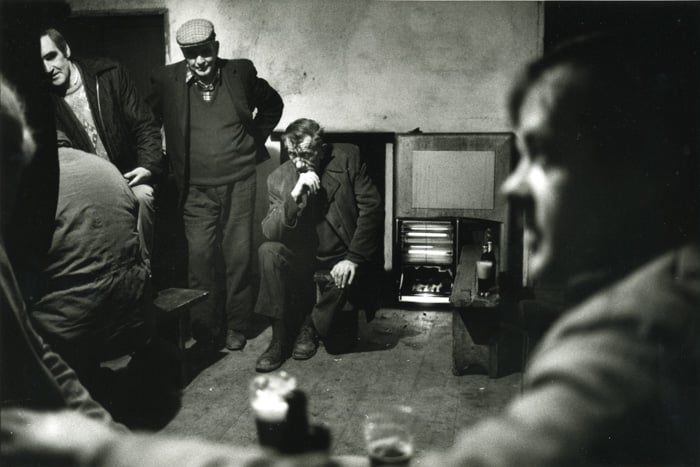 Black and white photo of men in a rural Irish pub