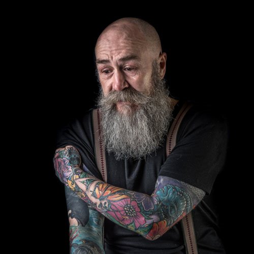 Portrait of man with arm tattoos - Jo Sutherst photography