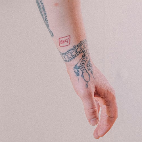 Tattooed arm featuring snake design - Jonjo Borrill photography