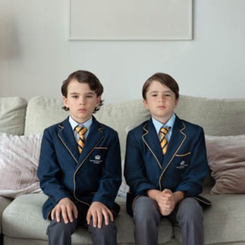 Two boys sit in school uniform - Roxana Savin photography