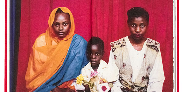 Two Sudanese women and a child pose for a photograph - Salih Basheer