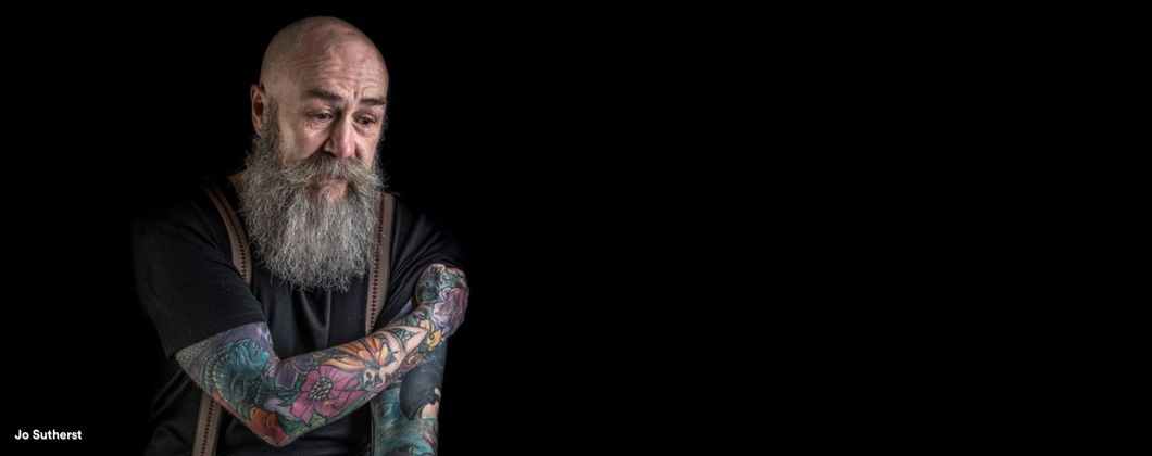 Portrait of man with arm tattoos - Jo Sutherst photography